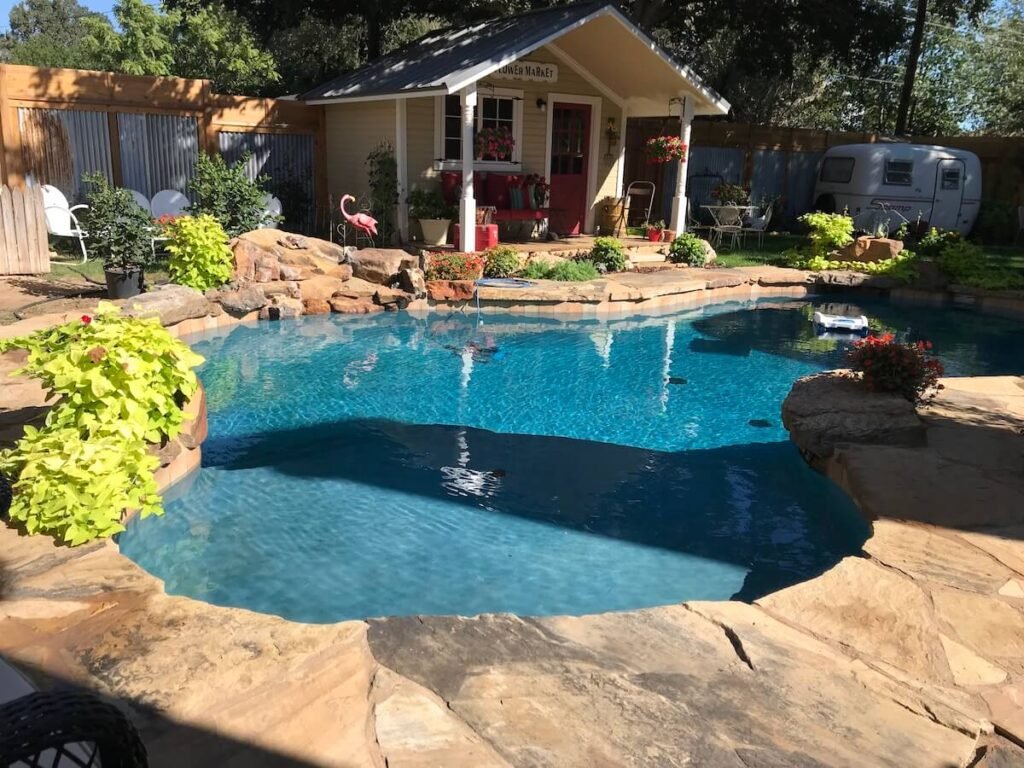 backyard pool with pool house