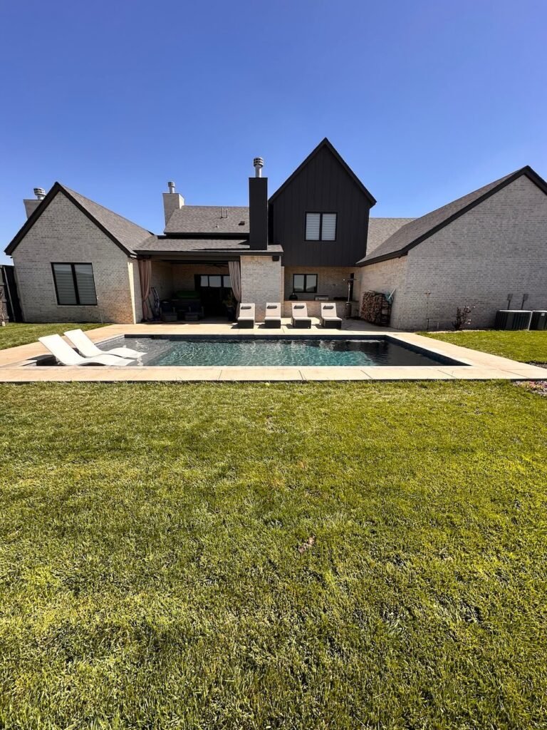 backyard pool with built in ledge